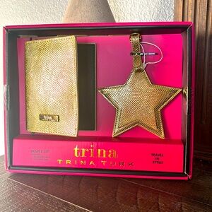 Trina Turk passport holder and luggage tag set. Gold, new in a box.